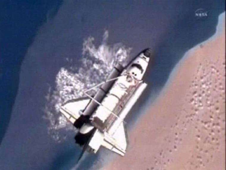 In a photo made from NASA television the Space Shuttle Discovery is 216 miles above the Sahara Desert after separating from the International Space Station on Monday.